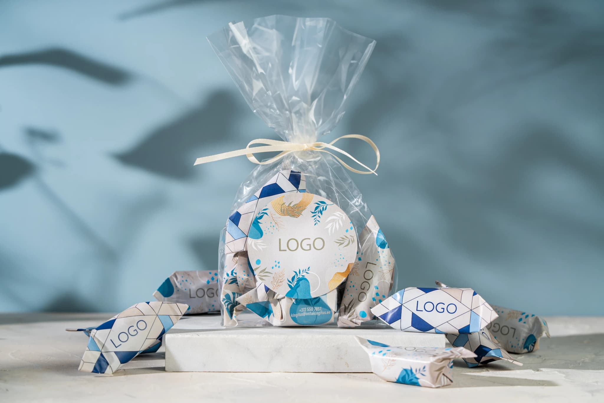 Small bag with ribbon and logo sticker